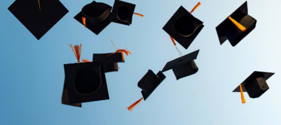 Graduation caps in the sky