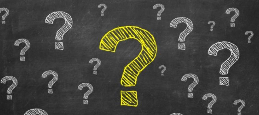 blackboard with question marks on it
